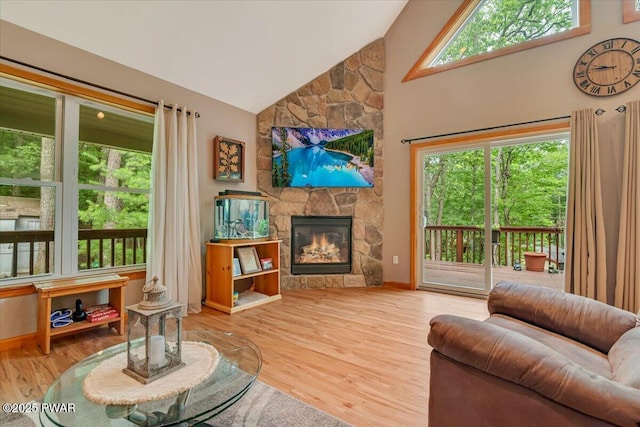 111 Sun Valley Dr, Tafton, PA 18464 - living area featuring high vaulted ceiling, a fireplace, and wood finished floors