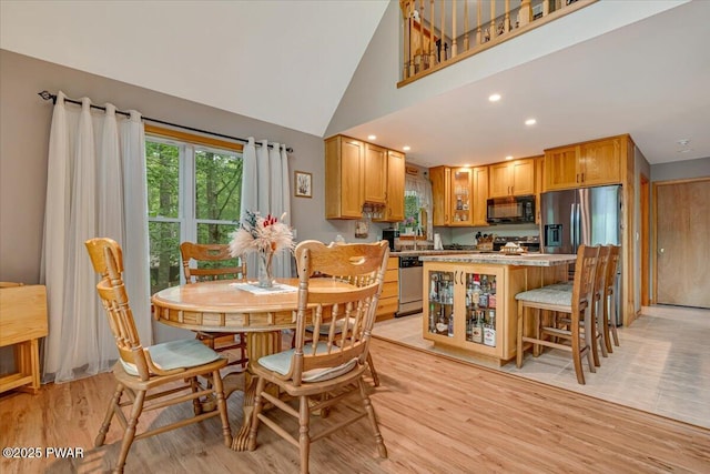 111 Sun Valley Dr, Tafton, PA 18464 - dining room with light wood-type flooring, high vaulted ceiling, and recessed lighting