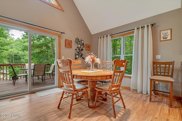 111 Sun Valley Dr, Tafton, PA 18464 - dining area with light wood-style flooring and high vaulted ceiling