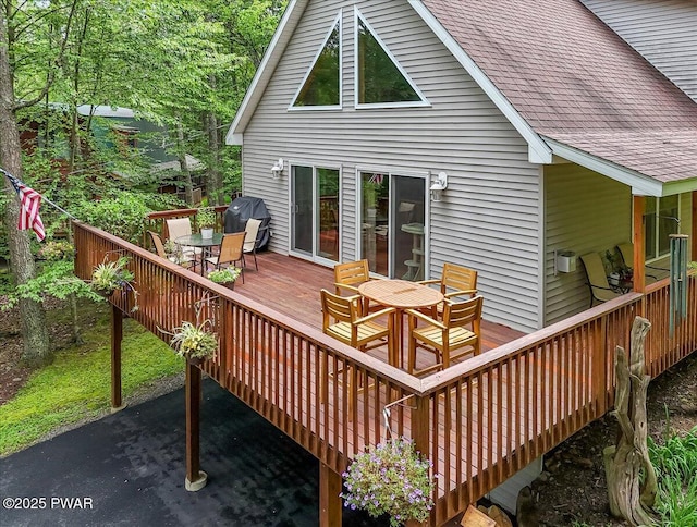 111 Sun Valley Dr, Tafton, PA 18464 - rear view of house featuring outdoor dining space, roof with shingles, and a wooden deck
