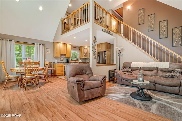 111 Sun Valley Dr, Tafton, PA 18464 - living room with light wood-style flooring, high vaulted ceiling, stairway, and recessed lighting