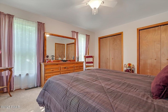 111 Sun Valley Dr, Tafton, PA 18464 - bedroom featuring light colored carpet, two closets, and ceiling fan