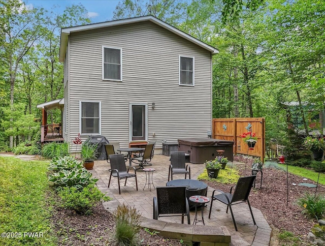 111 Sun Valley Dr, Tafton, PA 18464 - rear view of house with a hot tub, a patio, and an outdoor fire pit