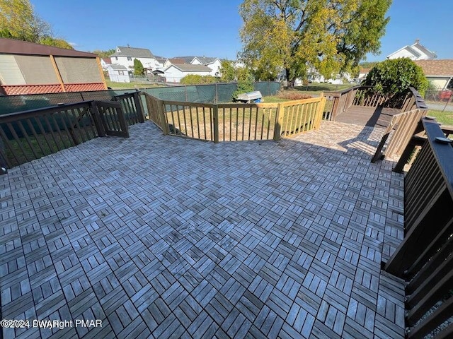 wooden terrace with a patio