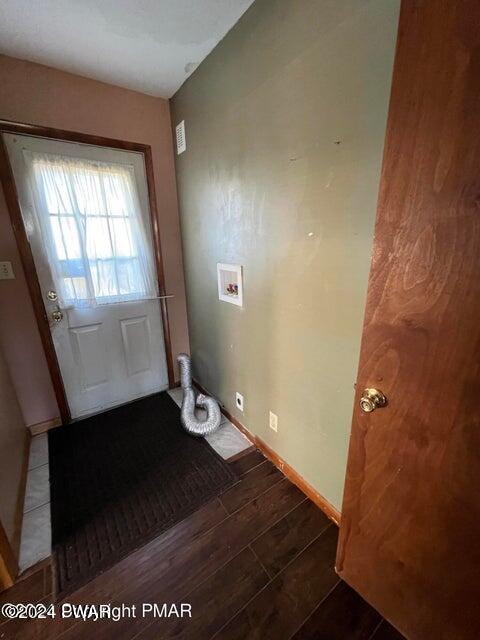 entryway with dark hardwood / wood-style floors