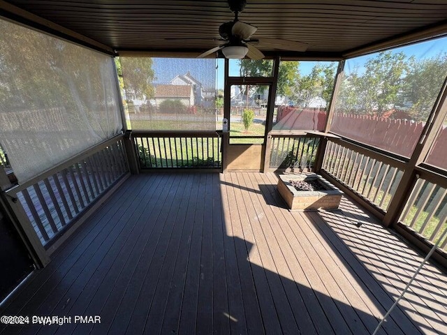 deck featuring a fire pit and ceiling fan