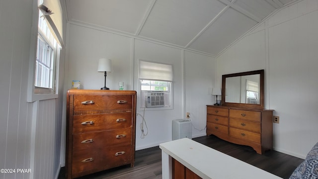 bedroom featuring cooling unit, dark hardwood / wood-style flooring, and lofted ceiling