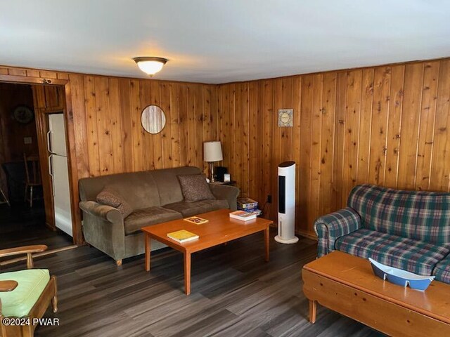 living room with dark hardwood / wood-style flooring