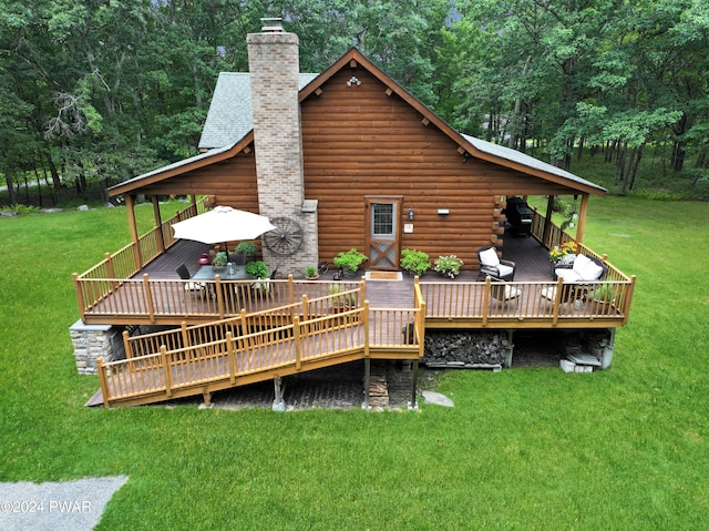 rear view of house with a lawn