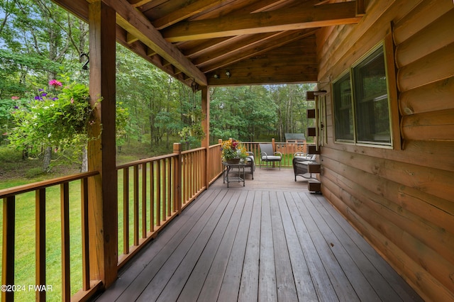 wooden terrace with a yard