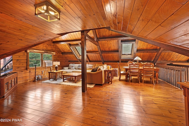 bonus room featuring wood walls, lofted ceiling, cooling unit, light hardwood / wood-style flooring, and wood ceiling