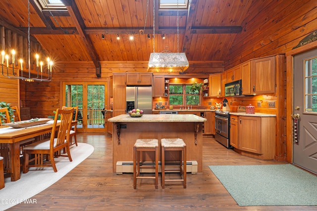 kitchen featuring appliances with stainless steel finishes, pendant lighting, a baseboard radiator, wooden ceiling, and beamed ceiling