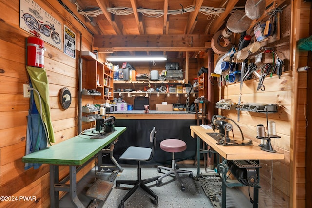 interior space with a workshop area and wooden walls