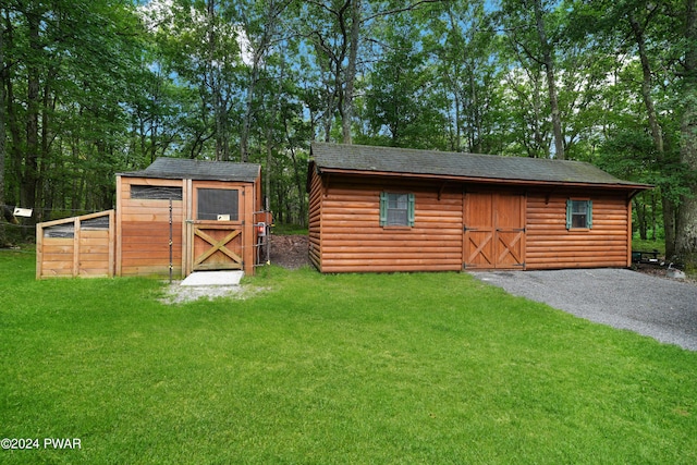 view of outdoor structure featuring a yard