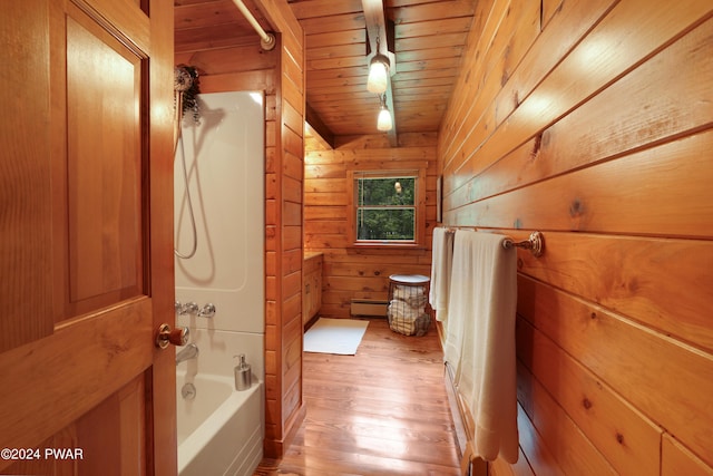 bathroom with hardwood / wood-style floors, a bathtub, wood walls, a baseboard heating unit, and wood ceiling