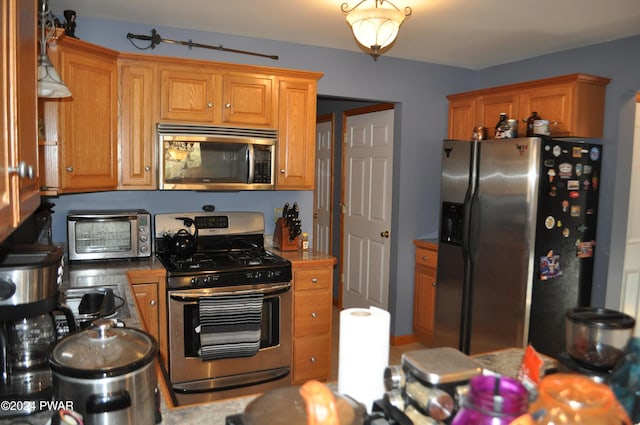 kitchen with appliances with stainless steel finishes