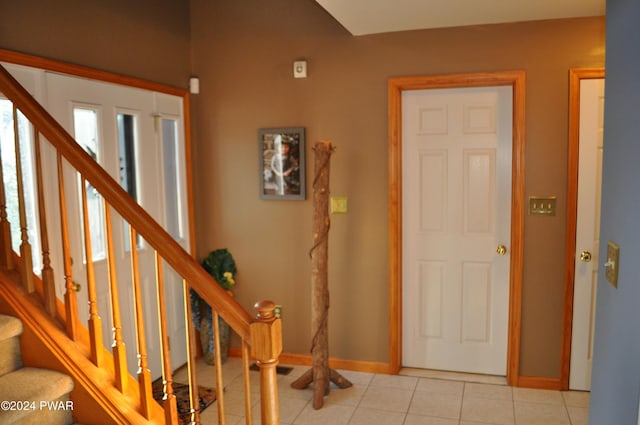 entrance foyer featuring light tile patterned floors