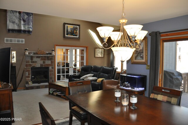 dining space featuring light tile patterned flooring and an inviting chandelier