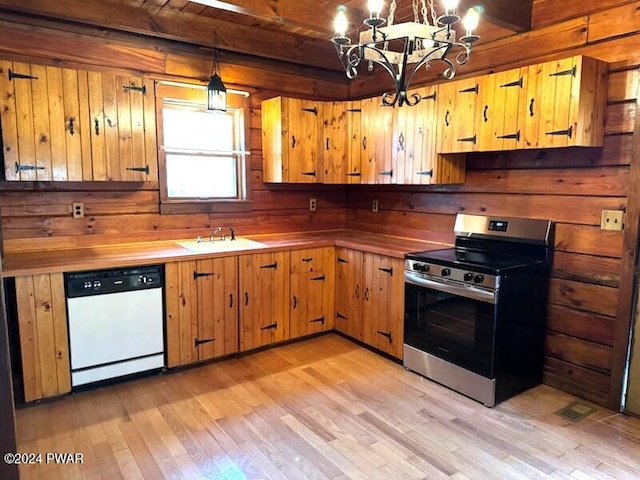 kitchen featuring stainless steel range, sink, wooden ceiling, white dishwasher, and decorative light fixtures