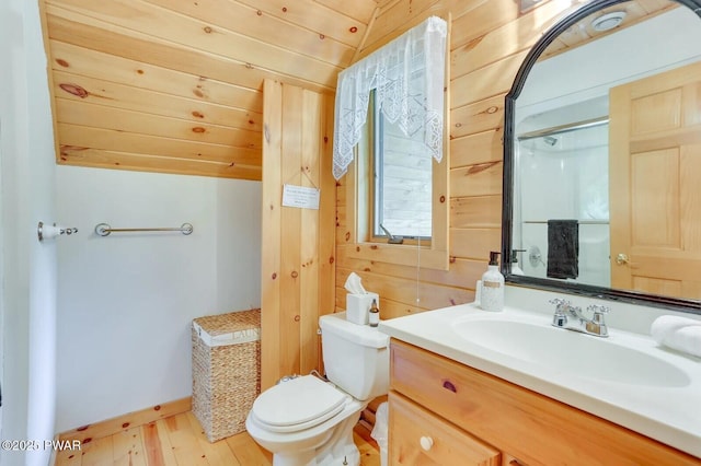 33 Syloro Ln, Damascus, PA 18415 - full bath with vanity, toilet, wooden walls, wood finished floors, and baseboards