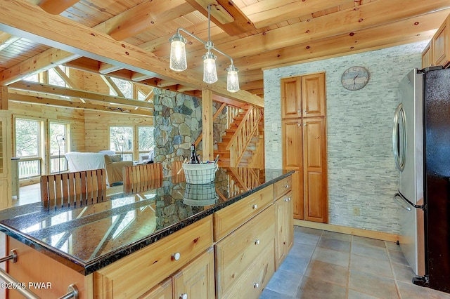 33 Syloro Ln, Damascus, PA 18415 - kitchen with freestanding refrigerator, wooden ceiling with exposed beams, dark stone countertops, pendant lighting, and a center island