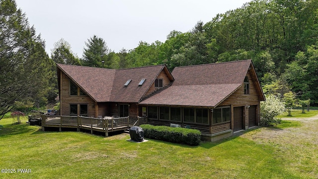 33 Syloro Ln, Damascus, PA 18415 - view of front of house with a wooden deck, roof with shingles, a garage, and a front lawn