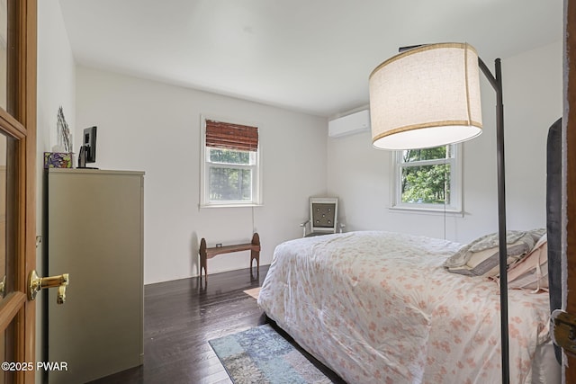 18 Tammany Flts, Damascus, PA 18415 - bedroom with multiple windows, dark wood-style flooring, and a wall mounted air conditioner