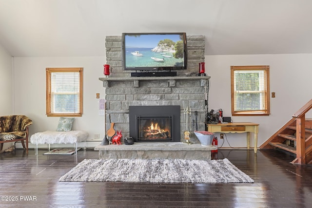 18 Tammany Flts, Damascus, PA 18415 - living area featuring plenty of natural light, wood finished floors, a stone fireplace, stairway, and lofted ceiling