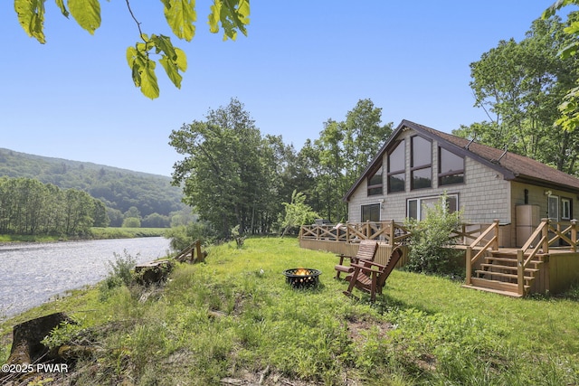18 Tammany Flts, Damascus, PA 18415 - view of yard featuring a fire pit, a deck with water view, and a view of trees