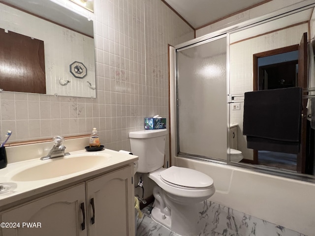 full bathroom with decorative backsplash, enclosed tub / shower combo, tile walls, and vanity