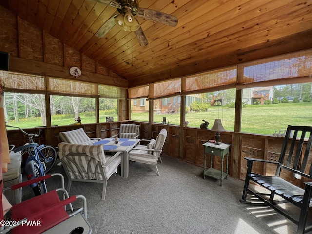 sunroom / solarium featuring ceiling fan, wooden ceiling, and lofted ceiling