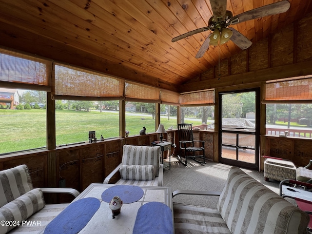 sunroom / solarium with ceiling fan, wooden ceiling, and vaulted ceiling