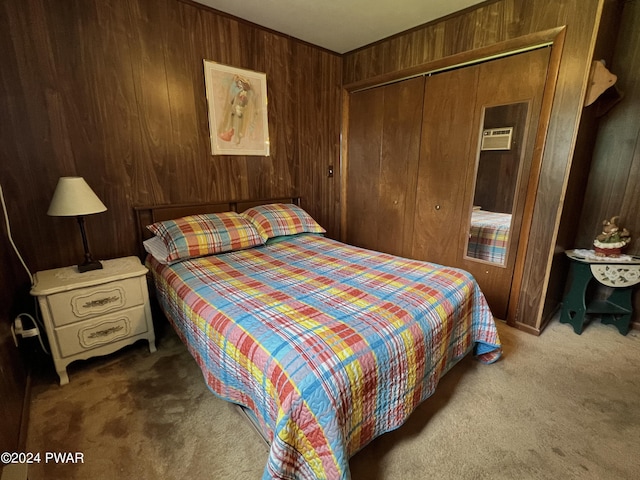 bedroom featuring carpet, a closet, and wooden walls