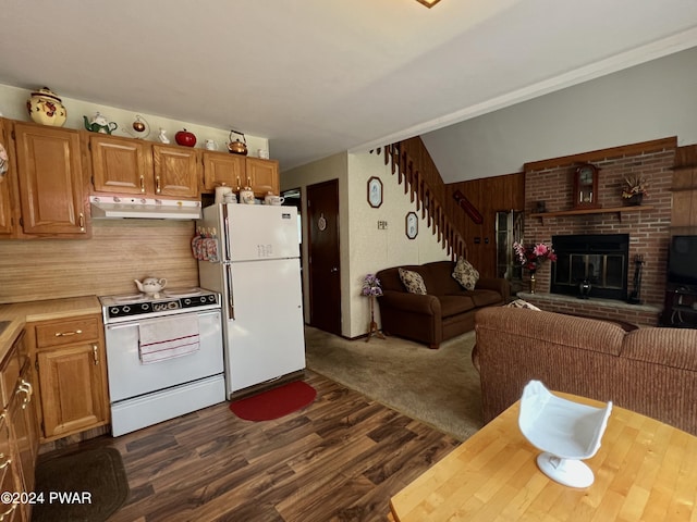 kitchen with range with electric stovetop, a fireplace, dark hardwood / wood-style floors, and white refrigerator