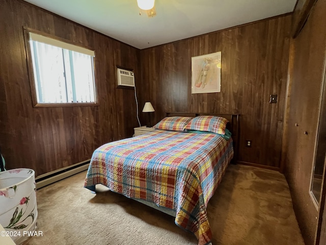 bedroom featuring wooden walls, ceiling fan, a baseboard radiator, carpet floors, and a closet