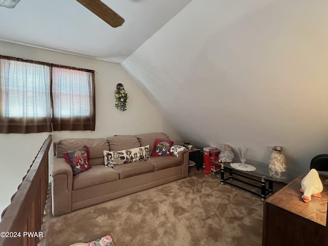 living room with ceiling fan, carpet, and lofted ceiling