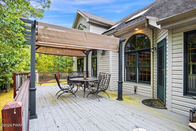 wooden deck with a pergola