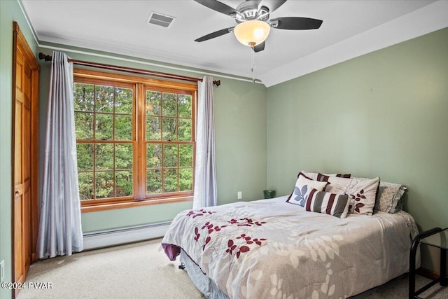 bedroom with carpet flooring, ceiling fan, and baseboard heating