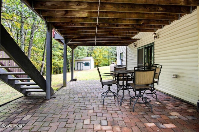 view of patio / terrace with a storage shed