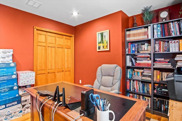 office space with light hardwood / wood-style flooring