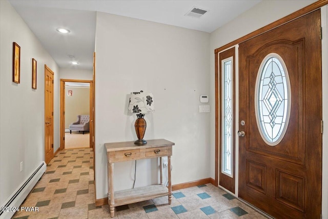 foyer entrance featuring baseboard heating