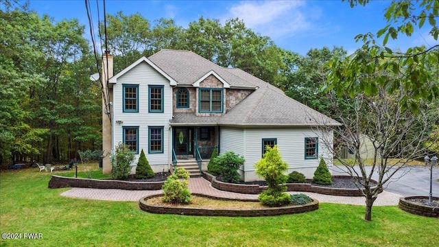 view of front facade featuring covered porch and a front lawn