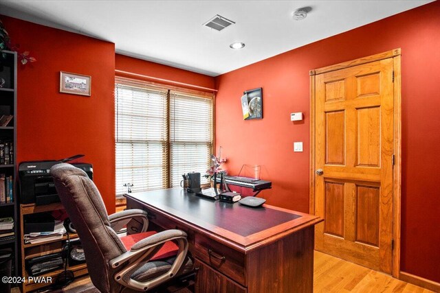 home office featuring light hardwood / wood-style flooring