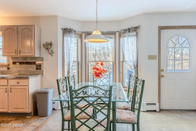 dining space with a baseboard radiator