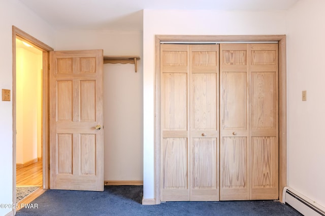 closet with a baseboard heating unit