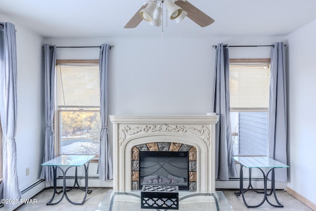 interior space with a baseboard heating unit, a wealth of natural light, and a premium fireplace