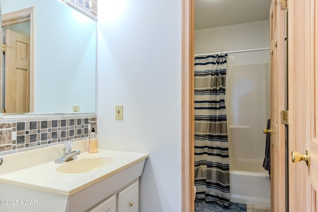 full bath with tasteful backsplash and vanity