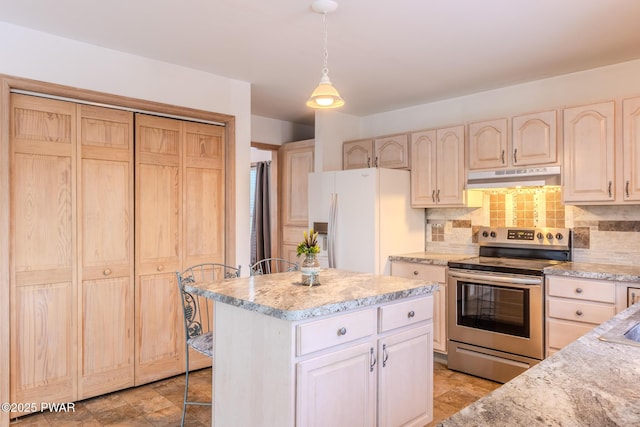 kitchen featuring white refrigerator with ice dispenser, electric stove, a center island, under cabinet range hood, and backsplash