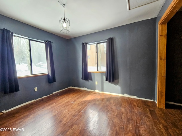 unfurnished room featuring dark hardwood / wood-style flooring