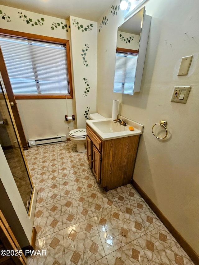 bathroom featuring vanity, toilet, an enclosed shower, and a baseboard heating unit